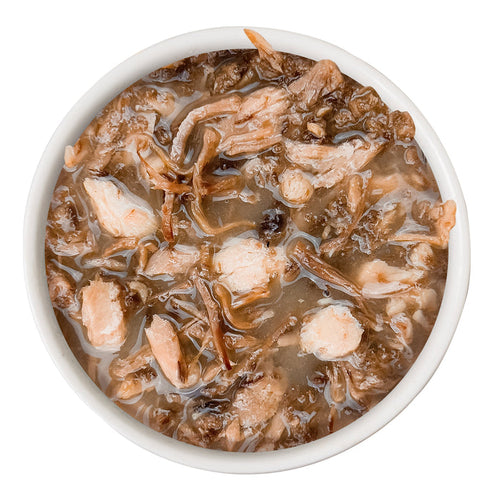 A top view of a white bowl filled with 1 If By Land, 2 If By Sea by Cats in the Kitchen—thick, brown soup with grass-fed beef chunks and shredded vegetables, set against a white background.
