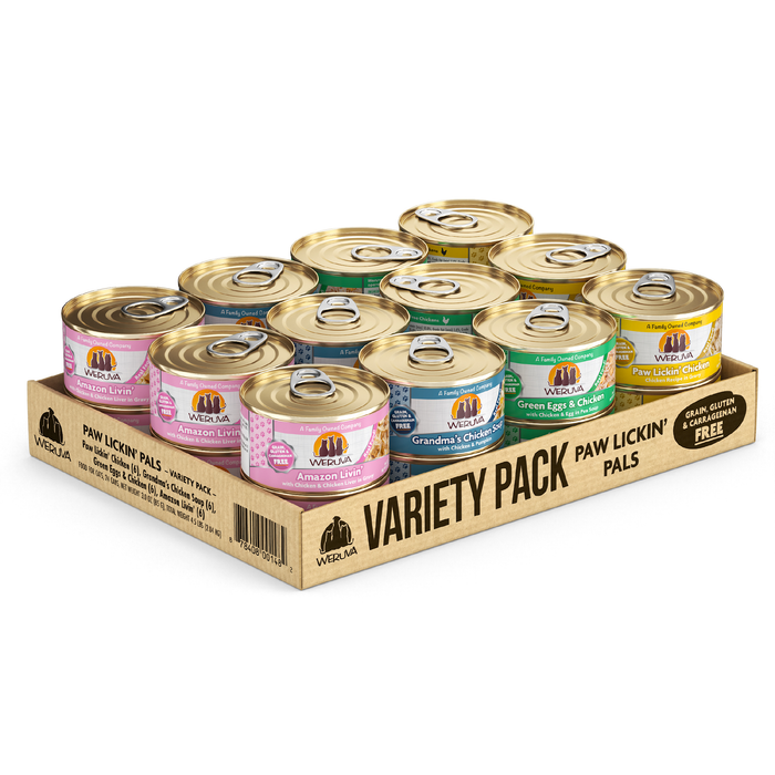 A cardboard tray contains twelve cans of Weruva Paw Lickin' Pals boneless chicken cat food in assorted flavors. The colorful variety pack features gold-topped cans with white breast meat chicken, and is grain, gluten & carrageenan free.