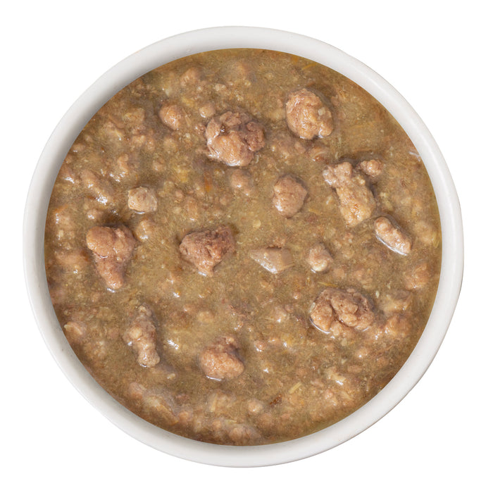 A bowl of Stewy Lewis by Weruva, chunky brown wet pet food in thick gravy with wild-caught salmon for natural omega-3s, viewed from above on a white background.